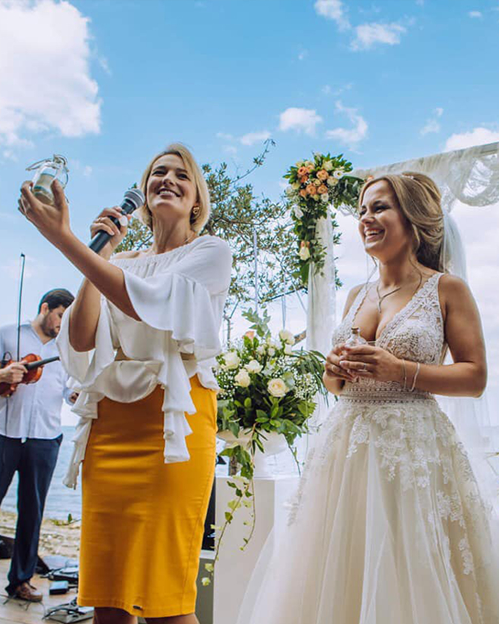Bride and host laugh together